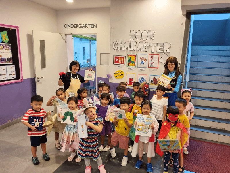 Children and teachers in story book costumes