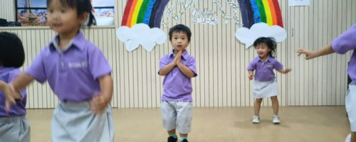 Children dancing in a hall